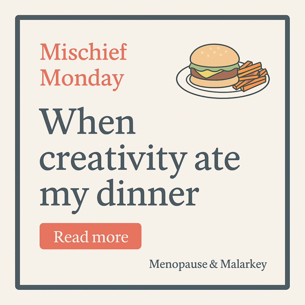Square graphic for Menopause & Malarkey’s Mischief Monday post titled “When Creativity Ate My Dinner.” Coral and cream text on a charcoal background with a playful image of a cheesesteak, sweet potato fries, and a notebook. Tagline reads, “When the muse wins and the meal loses.”